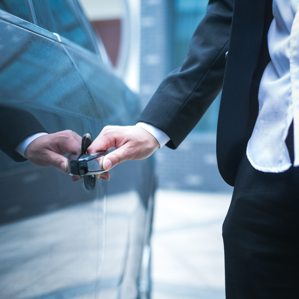business man opens door